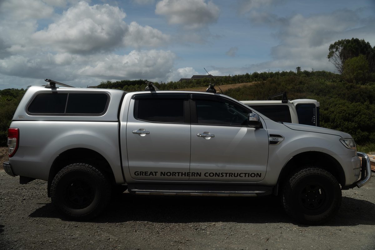 Silver double-cab ute with Great Northern Construction written along its doors